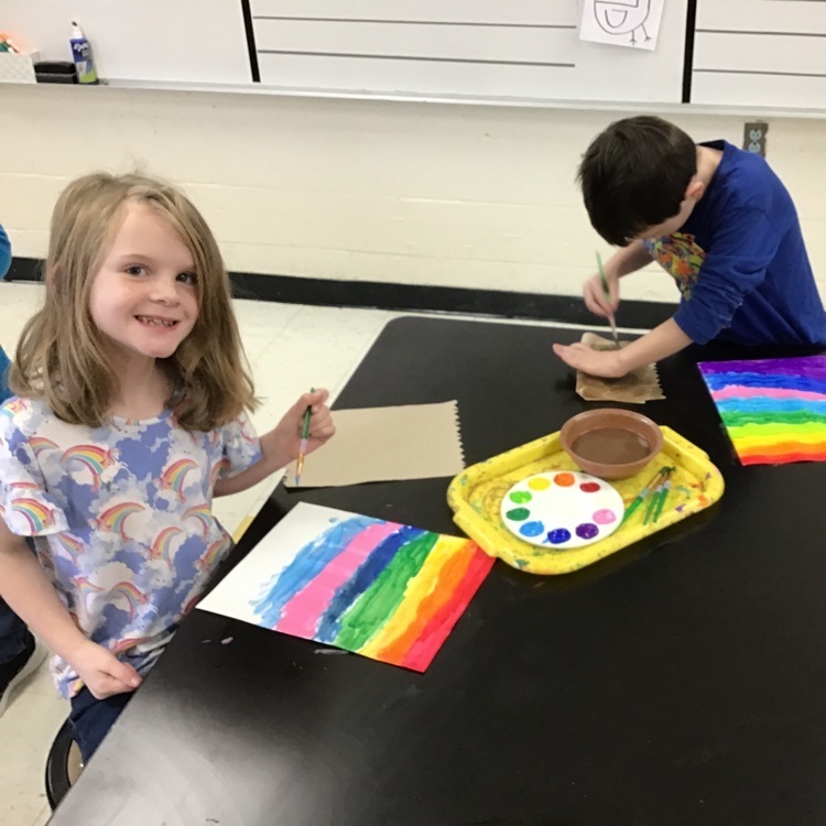1st graders were painting their rainbow backgrounds this week.